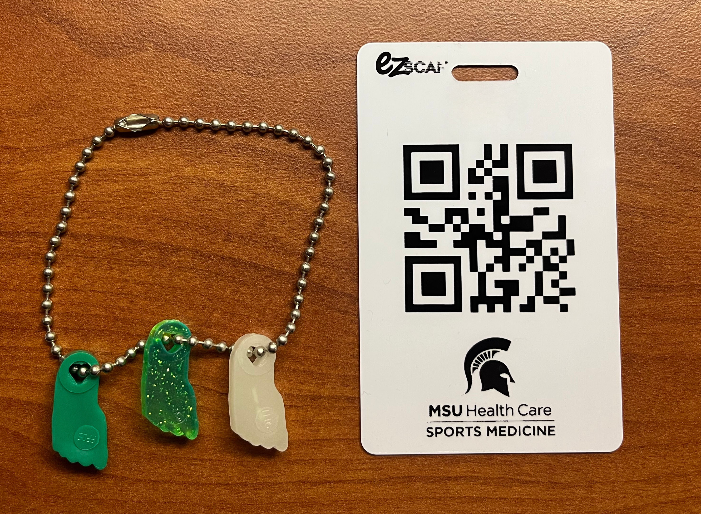 MSU Health Care Sports Medicine Mileage Club badge and Toe Tokens