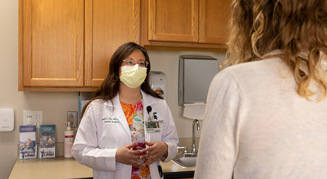 Dr. Lin consulting with patient